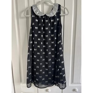 Girls kid Topia, sleeveless black dress with silver bows size 14–16